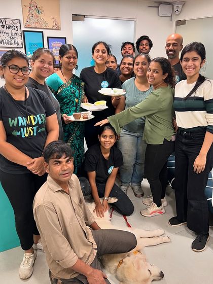 A moment of celebration with the team. These people are my rock, supporting me through personal health challenges while helping grow our business and care for the dogs.