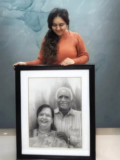 This is the finished portrait of my Naana and Naani, which I named "Laadvo". It's a hand-drawn family portrait created with graphite and charcoal on high-quality Fabriano paper to ensure it lasts for generations. Each line is filled with love and memories.