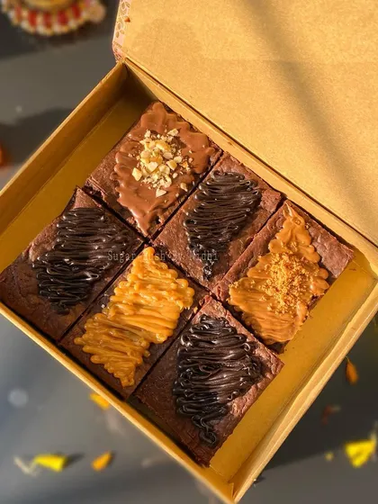 My assorted brownie box in festive Diwali packaging. You can choose a box of 4 or 6, with flavors like Nutella, Biscoff, and Caramel.