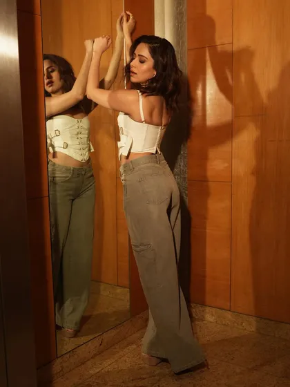 This shot uses the mirror to create a double image, adding depth and a contemplative feel to the portrait.