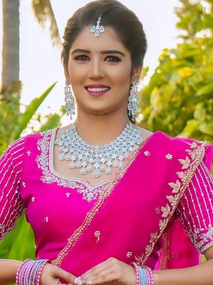 A smiling bride wearing a simple American diamond necklace set. It's a perfect choice for an engagement or a reception.