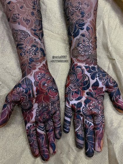 A fresh stain with a unique reddish-black tone, which will continue to darken. Every person's skin takes the stain a bit differently.