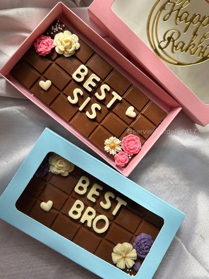 Another look at the Rakhi gift boxes, complete with a "Happy Rakhi" tag. It's a simple, delicious way to celebrate your sibling.