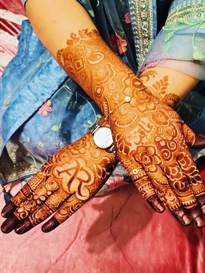 A beautiful stained design with the initials 'AR' and the name 'Faizan' clearly visible.