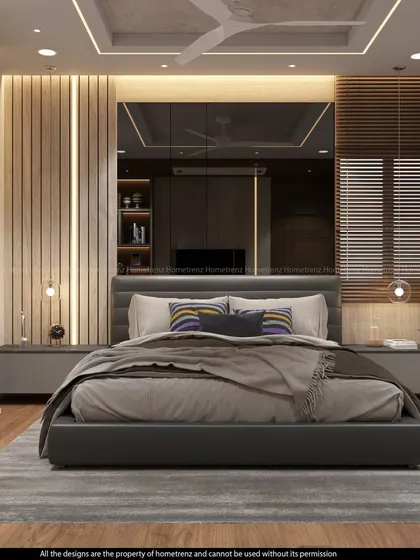 This master bedroom uses a large mirror behind the bed to create an illusion of depth. The combination of wood slats and soft lighting adds warmth and texture.