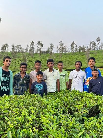 A group of boys from the KRIES camp enjoying the lush green landscape of Barapole.