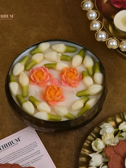A closer look at the jasmine and orange lotus urli candle, showing the delicate, hand-poured details.