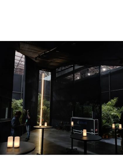 The Durall Pavilion was designed as a place to pause, a respite from the cacophony of an exhibition. It is a black, mesh clad folly that could be a church, a meditation hall, or an aviary. It is a space for peace.