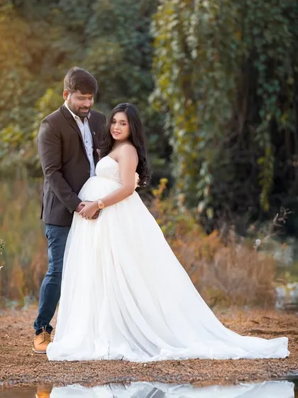 There's a special magic in capturing the connection between partners as they wait for their little one. This serene, lakeside portrait uses the soft, golden hour light to highlight their shared love and anticipation in a quiet, natural moment.