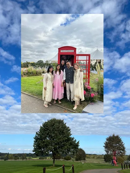 Our team and clients posing with an iconic red telephone booth, a fun nod to the UK location. We love incorporating local flavor into our destination weddings.