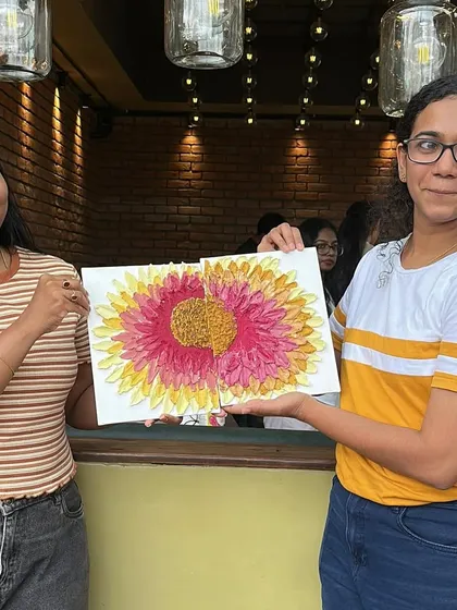 Two friends showing off their completed texture art piece. It’s amazing how different interpretations of the same subject can be.