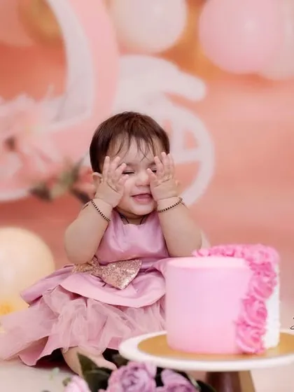 A playful game of peek-a-boo during her first birthday session. I love capturing these spontaneous, adorable moments that show off a child's personality.