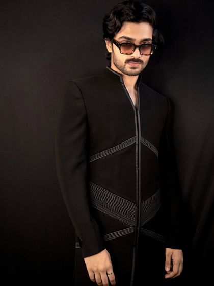 The 'Grooved Lines' jacket, another of my signature designs. This piece features structured, geometric lines on a sharp black Indo-Western silhouette for a modern and edgy look.