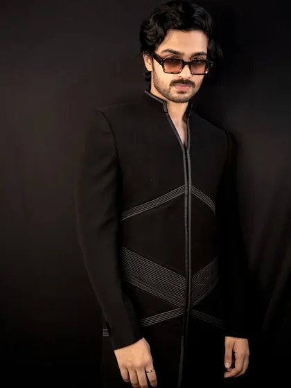 The 'Grooved Lines' jacket, another of my signature designs. This piece features structured, geometric lines on a sharp black Indo-Western silhouette for a modern and edgy look.
