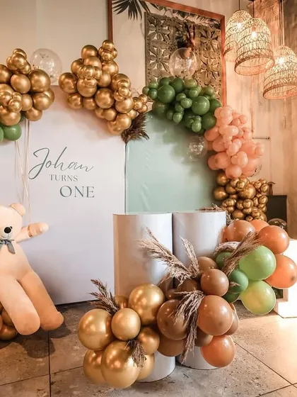 Another shot of the main backdrop for Johan's party, showing the organic balloon arch and the cute teddy bear prop.
