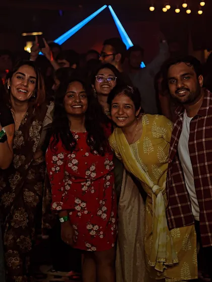 A great shot of the crowd, with everyone smiling and enjoying the party atmosphere.