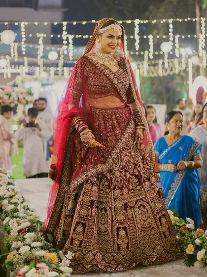 Another shot of the bride's grand entrance, showcasing the stunning details of her lehenga and the confidence she exudes with her flawless look.