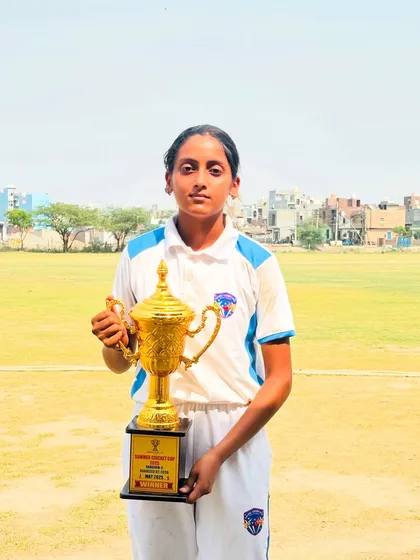 Our female captain holding the Summer Cricket Cup trophy. A proud moment for her and the entire academy.