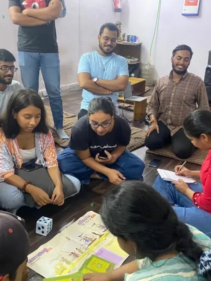 Participants play a board game designed to teach them about their duties as citizens. Gamification is a key part of our methodology to make learning fun and effective.