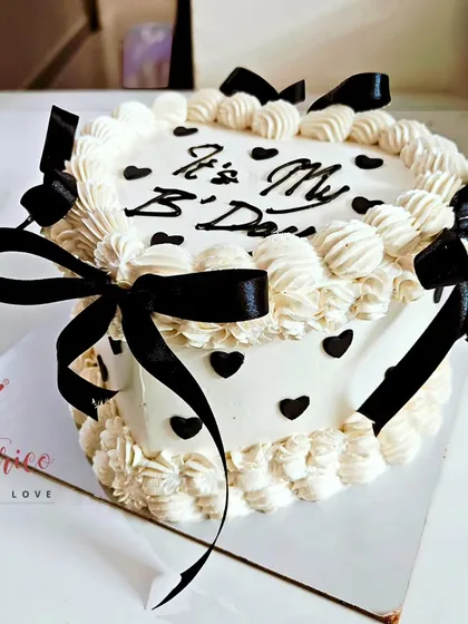 For a touch of elegance, I designed this minimalist Mocha Cake. The combination of coffee and chocolate is timeless, and the simple buttercream piping and black ribbon details make it a sophisticated choice for any celebration.