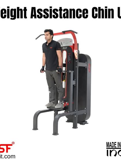 A user standing on the Weight Assistance Chin Up machine.