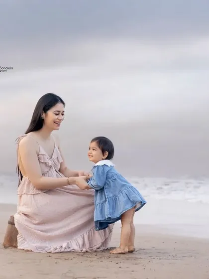 Sweet moments between a mother and her mini-me on the beach. These are the memories that will be cherished for a lifetime.