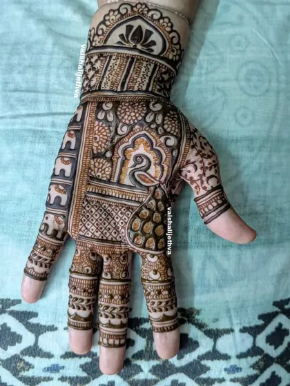 An intricate Indian design for a single hand. This pattern is dense with traditional elements like peacocks, elephants, and checks, perfect for someone who wants a heavy design on one hand.