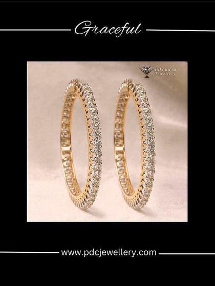 A graceful pair of 20-pointer single-line diamond bangles in 14kt hallmarked gold. This is a classic and versatile piece for any jewellery collection.