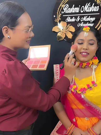 Here I am in my element, teaching the art of makeup at my academy. I believe in sharing my knowledge and empowering aspiring artists with hands-on techniques for creating professional looks.