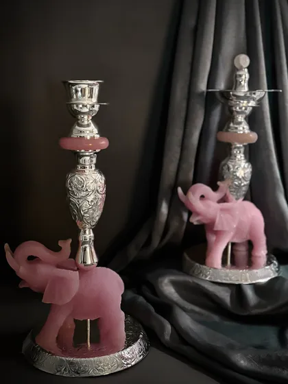 Here, I combine the gentle energy of rose quartz with the strength of metal. These unique candle stands feature elephants carved from natural stone, supporting ornate silver-toned holders that bring a ritual of grace and light to your space.