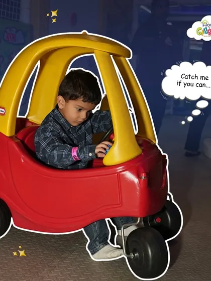 Catch me if you can! This little driver is on the move in our toddler play zone, enjoying the freedom to explore in a classic kid-powered car.