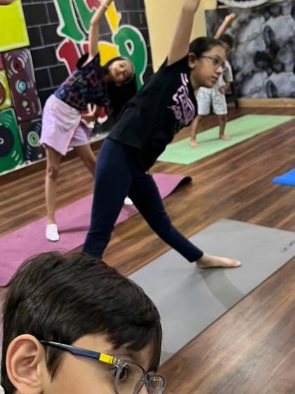 Our pre-teens work on Trikonasana (Triangle Pose) in this class. This pose is fantastic for stretching the entire body and improving balance.