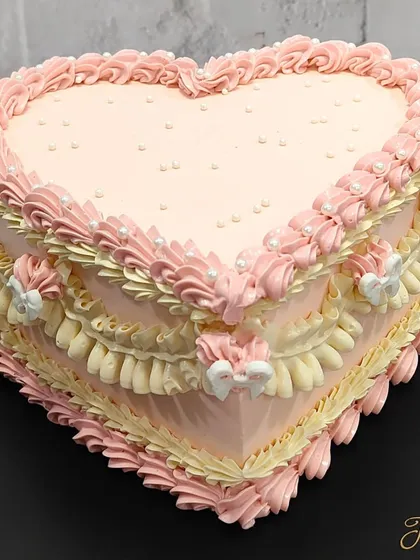 I absolutely love the vintage cake trend. This heart-shaped cake with intricate, old-school piping is a beautiful way to show someone you care. It’s perfect for birthdays, anniversaries, or just because.