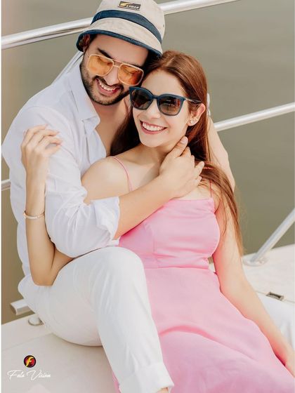 A happy, relaxed portrait of the couple enjoying their time on the yacht. We aim to make our pre wedding shoots feel like a fun date, capturing genuine smiles and laughter.