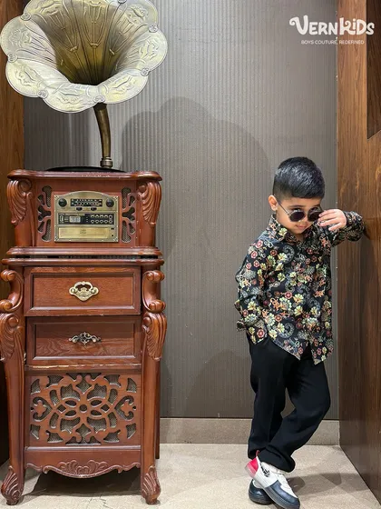 It's all in the attitude. Here, the star-embellished blazer is styled down with a floral shirt, showing its versatility for a cool, edgy look.