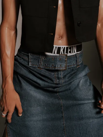 A detail shot focusing on the styling of a denim skirt over Calvin Klein underwear. This highlights my approach of layering and combining unexpected pieces to create a fresh look.