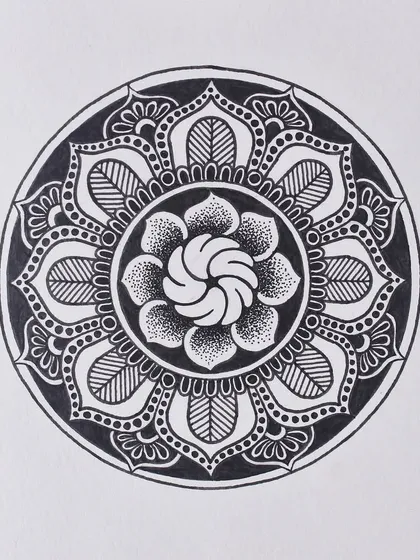 A floral mandala design from my Inktober series. This piece combines line work and dot work to create different textures within the petals.