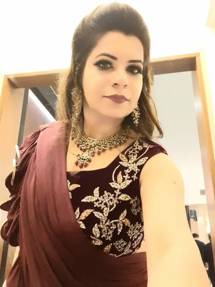 This client wanted a bold look for an evening reception. We went with a deep, smokey cat-eye and a rich berry lip color that matched the tones in her embroidered blouse.