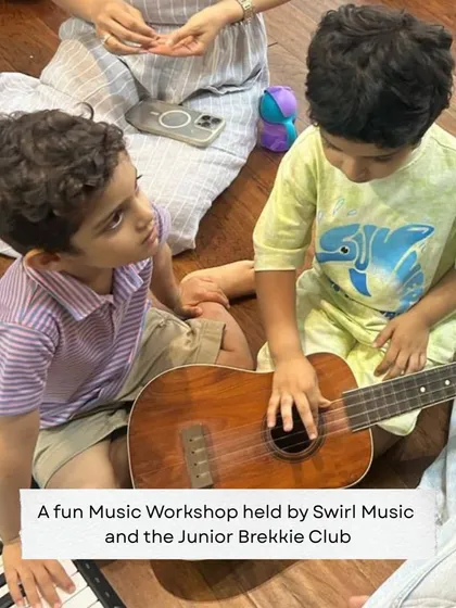 Learning starts with play. This photo from a music workshop with the Junior Brekkie Club captures the joy and curiosity we nurture in our youngest students. We make their first experience with music a happy and engaging one.