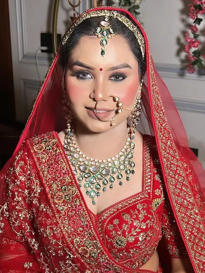 A straight-on portrait of my bride Himanshi, showcasing the symmetry and precision of her bridal makeup. The smokey eye is perfectly blended for a captivating look.