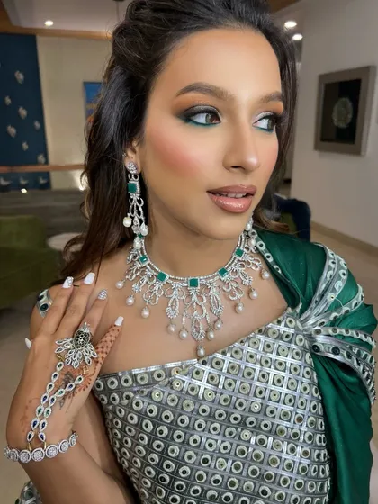 This look was pure art. We created a modern, high-fashion statement with a bold green-touched gaze to complement her couture gown. It’s a perfect example of how makeup can be both loud and graceful.