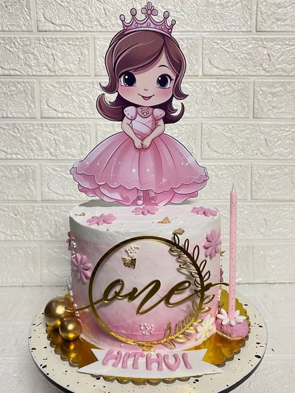 A closer look at the "one" topper and delicate details on our first birthday princess cake.