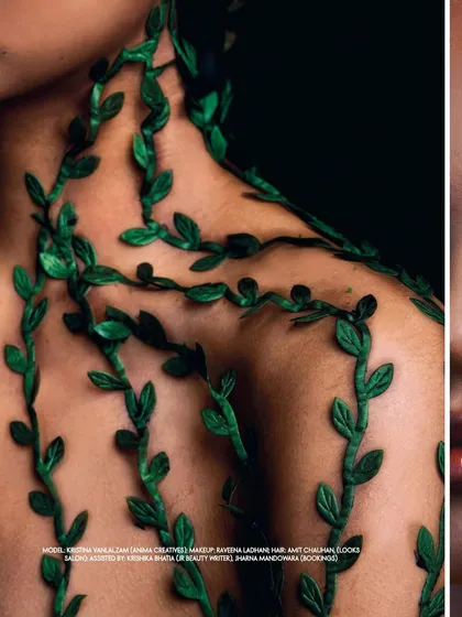 A detail shot from the 'Becoming Earth' editorial, focusing on the texture of the artificial vines applied to the model's shoulder. This highlights the meticulous detail of the art direction.