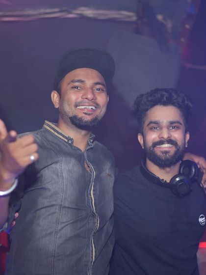 Sharing a smile with a fellow artist. The nightlife scene is a small world, and the friendships you build are for life.