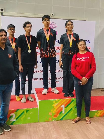Our team celebrating their wins at the Karnataka State Shooting Competition. Standing on the podium together is a rewarding experience for our young athletes.