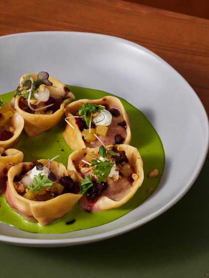 A close-up of the Beetroot Tortellini, showing the delicate pasta pockets filled with a savory beetroot mixture.