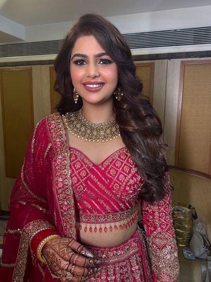 A smiling shot of the bride, looking happy and confident in her reception attire.