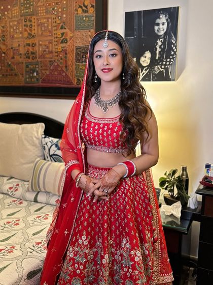 Nothing beats a crisp red lip for a bridal look. Here, we paired it with clean, minimal eye makeup to create a look that is both bold and sophisticated.