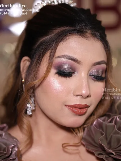 This close-up shows the detailed smokey eye with a touch of glitter, a popular and versatile look for any evening event.