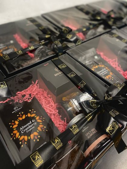 Another angle of the bespoke gift boxes we designed for Runwal Realty. The clear lid showcases the handcrafted products inside, while the custom ribbon reinforces the brand's identity. It’s a perfect blend of our quality and their branding.